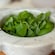 Fresh basil leaves in a stone mortar